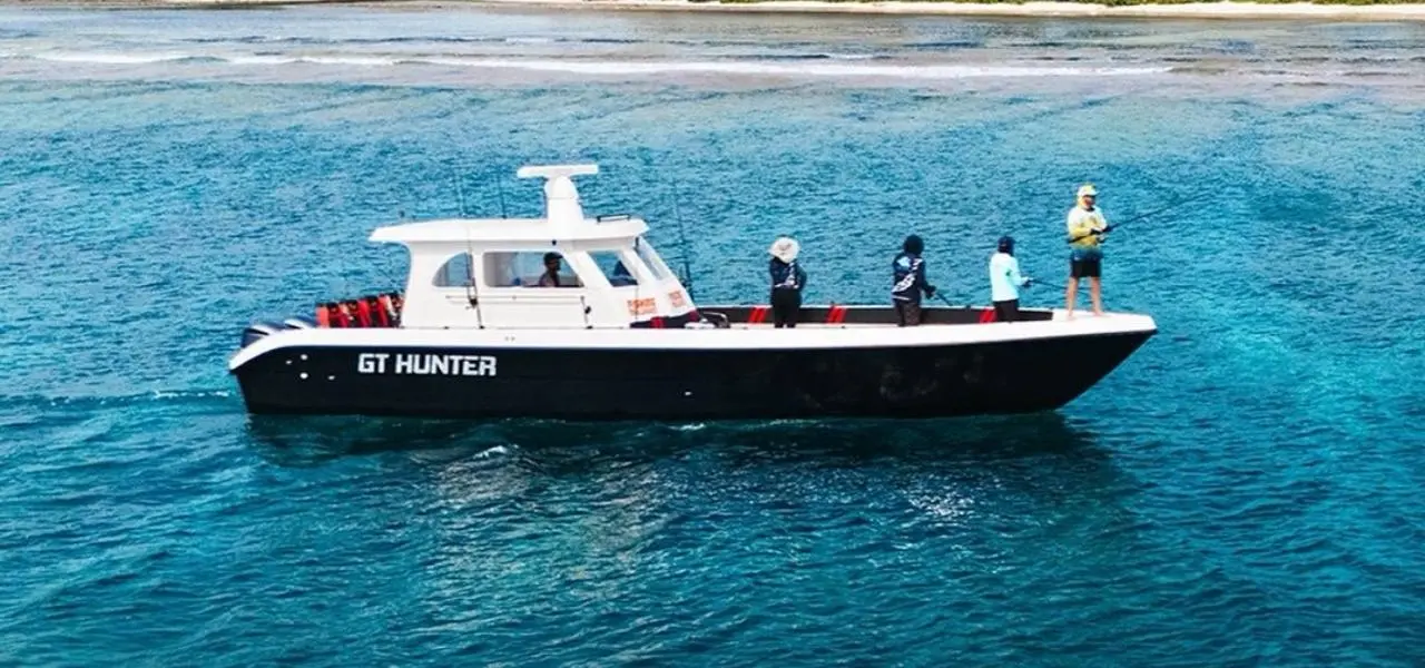 Fishing charter boat at sunset Male Atoll